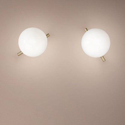 Modern gold and white LED wall lamp with glass shade for bedroom and living room