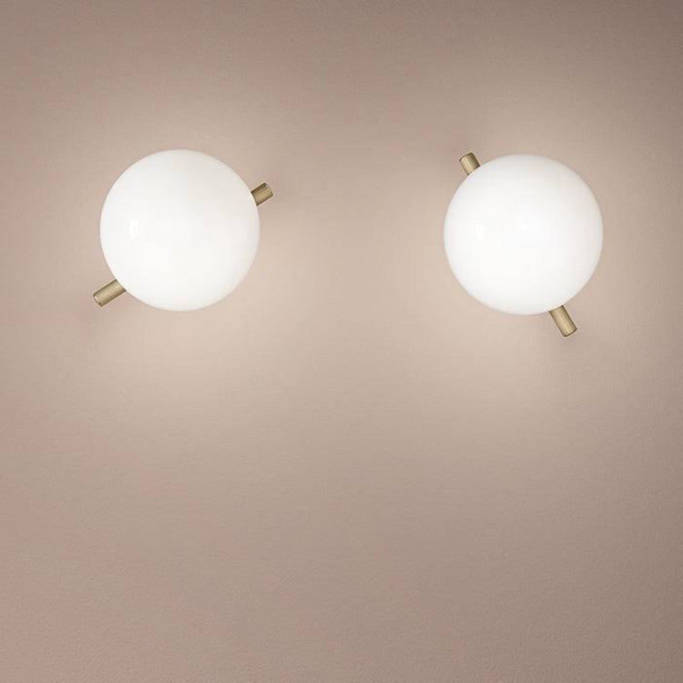 Modern gold and white LED wall lamp with glass shade for bedroom and living room